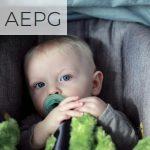 baby on gray stroller